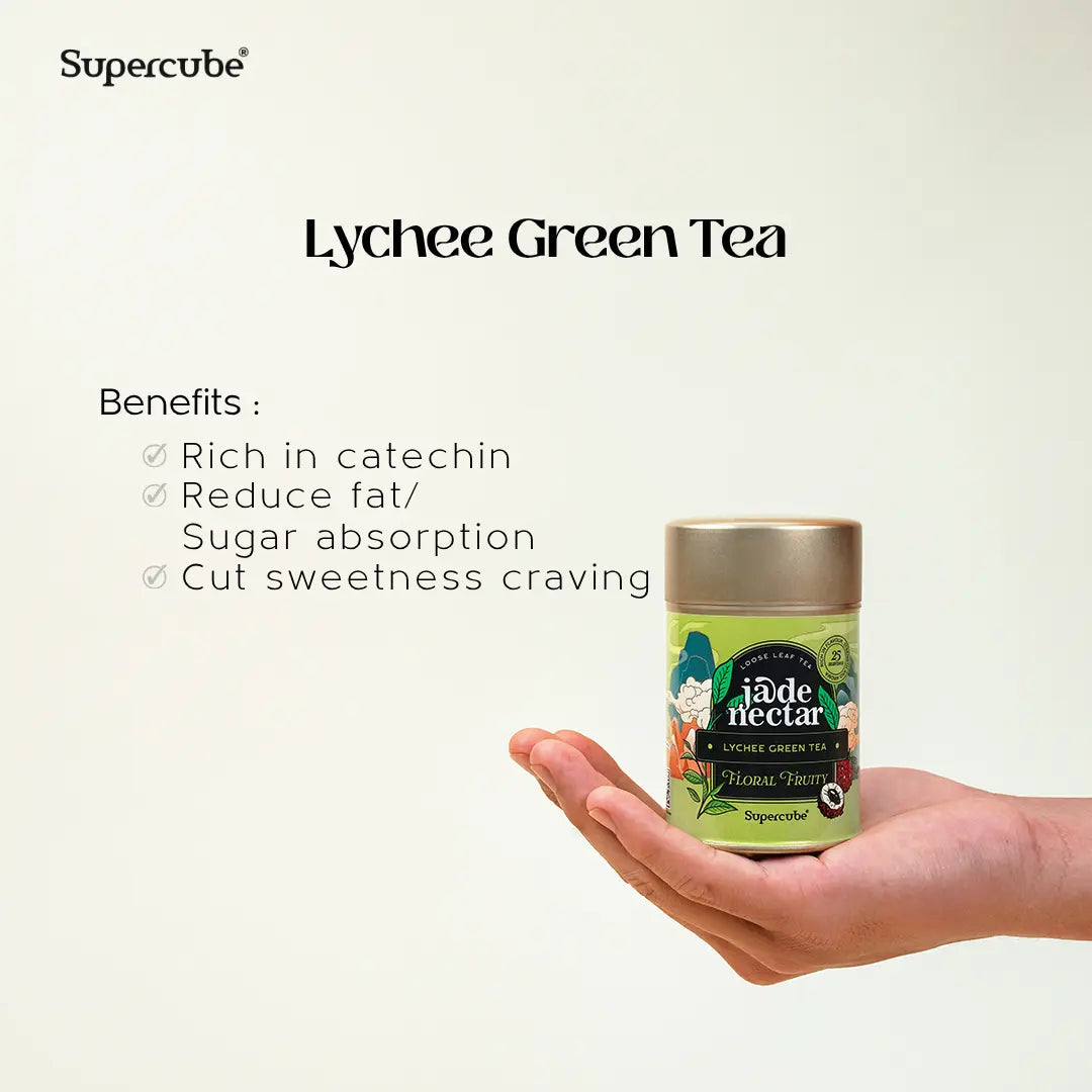 Hand holding Supercube Lychee Green Tea tin with benefits rich in catechin that cut sugar cravings